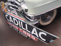 Image 2 of 3 of a N/A CADILLAC USED CAR SIGN