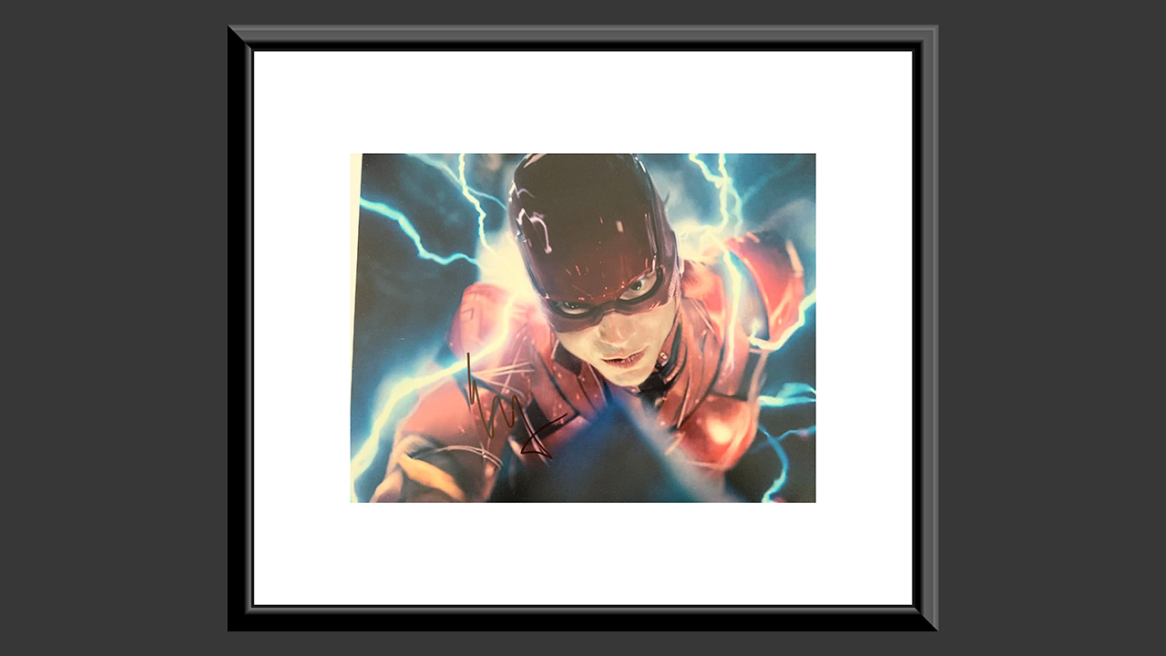 0th Image of a N/A JUSTICE LEAGUE EZRA MILLER SIGNED MOVIE PHOTO